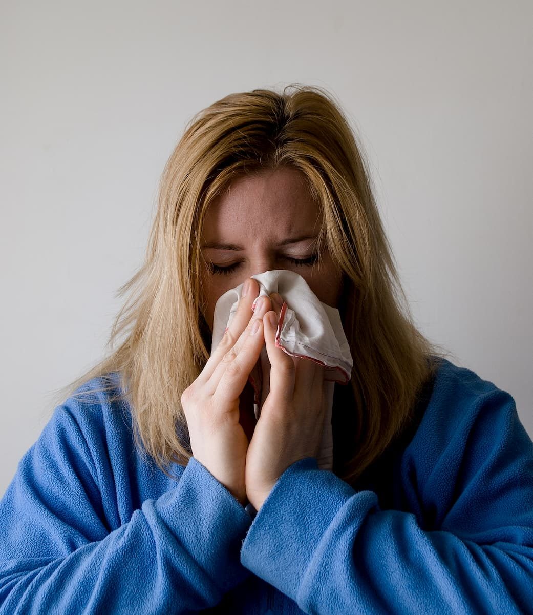 Woman Blowing Her Nose