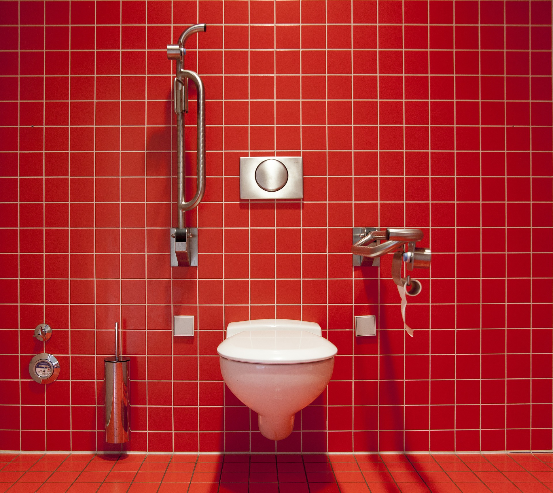 Red tile bathroom with toilet