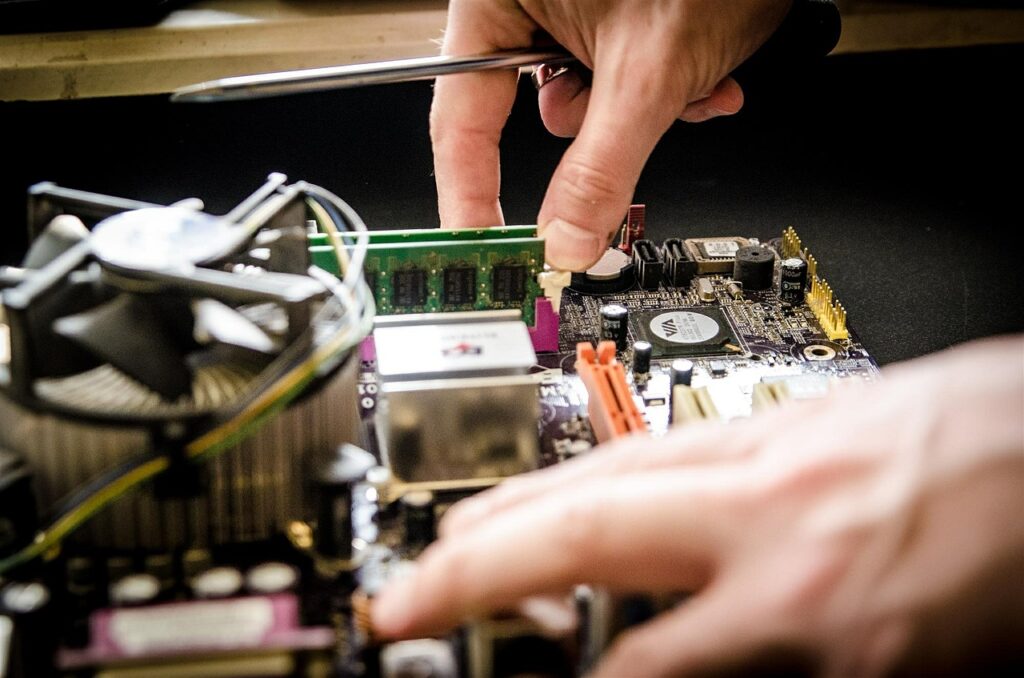 Person repairing an electronic board