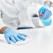 Person cleaning the table at laboratory